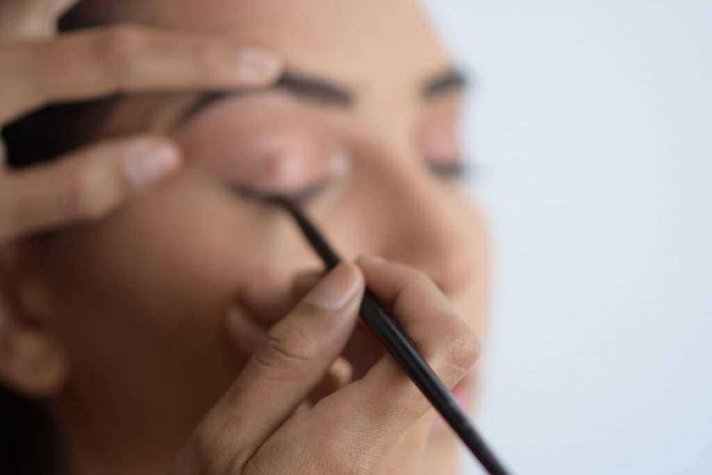 Makeup Artist working in the eyes
